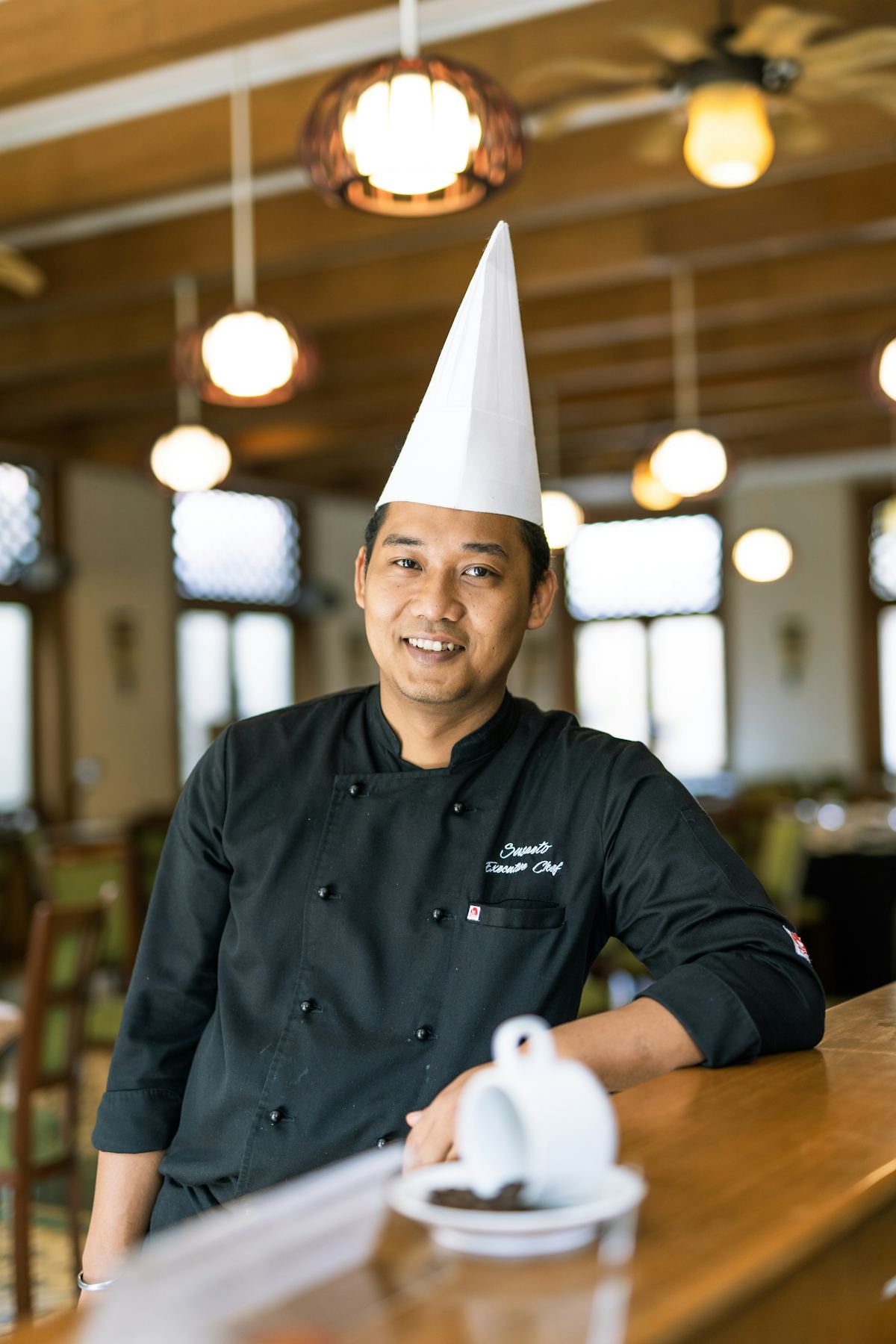 A cook plating portions in our kitchen