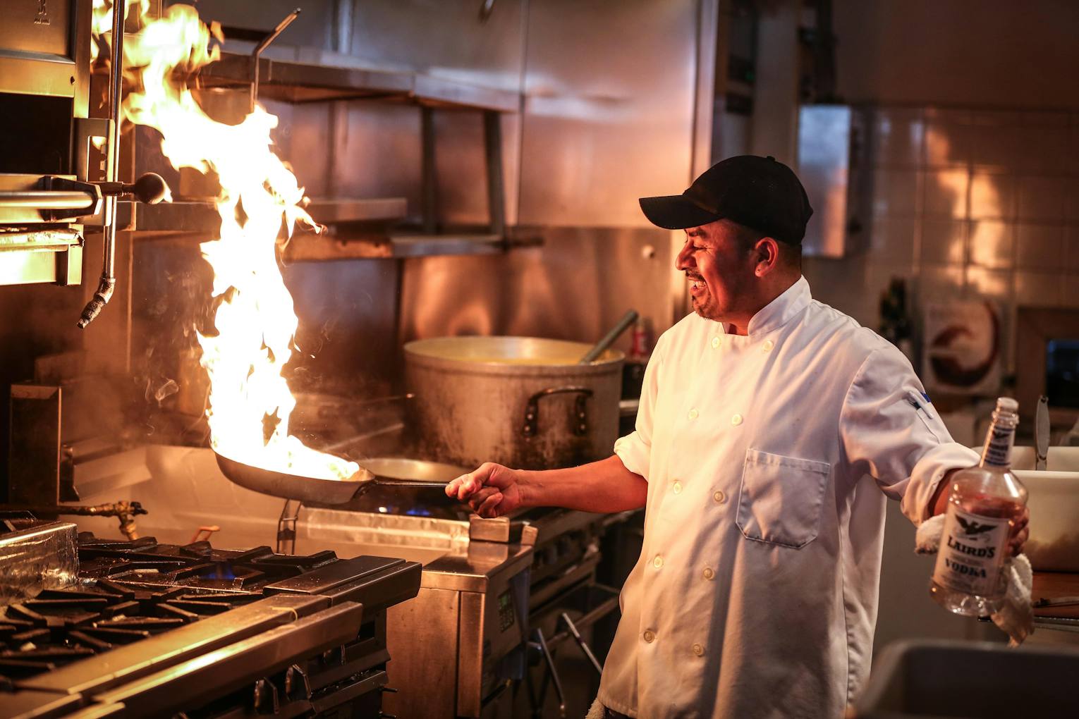 A cook working the line in a commercial kitchen
